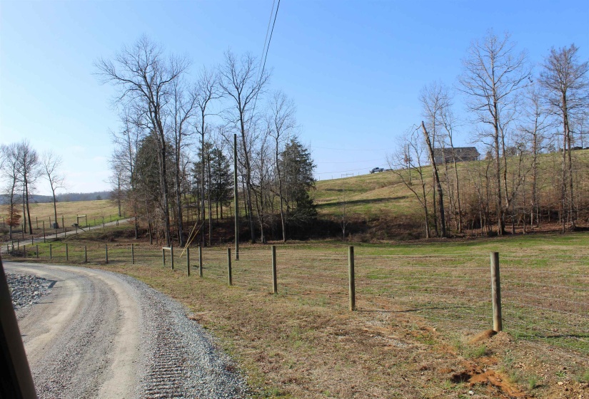 View of dirt / gravel road featuring a rural view