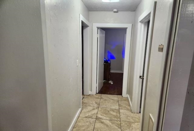 Hall with light tile patterned floors