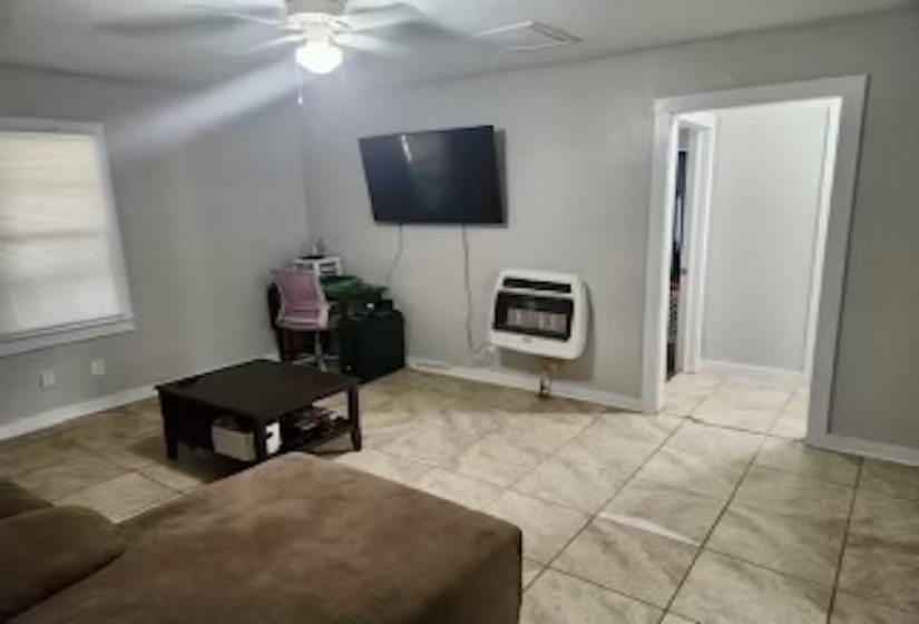 Tiled living room with ceiling fan
