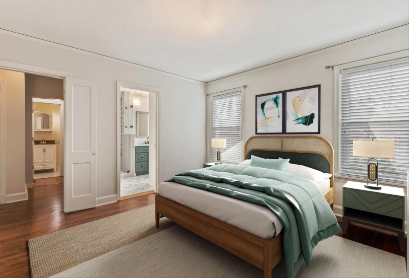 Bedroom featuring ensuite bathroom and wood finished floors. (Virtually staged)