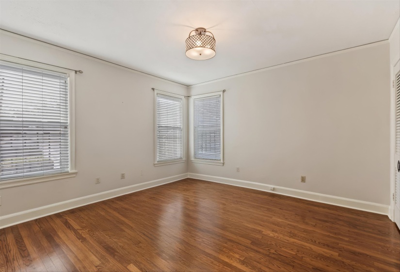 room with dark wood-style floors and baseboards