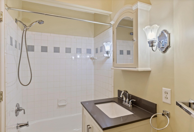 Full bathroom featuring washtub / shower combination and vanity