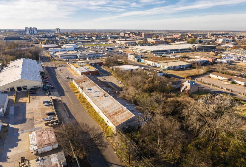 Aerial overview of property's location featuring industrial structures