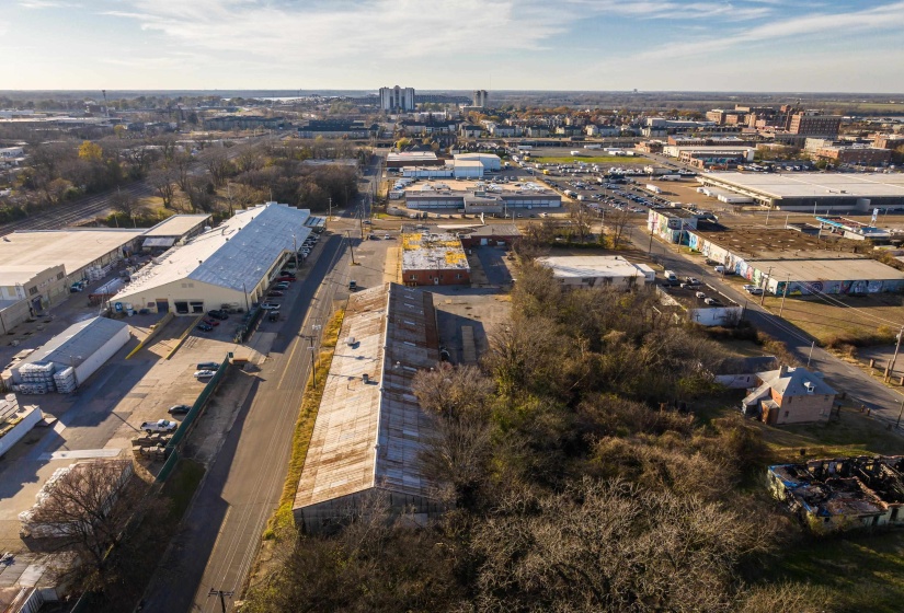 Aerial view of property's location with an industrial area