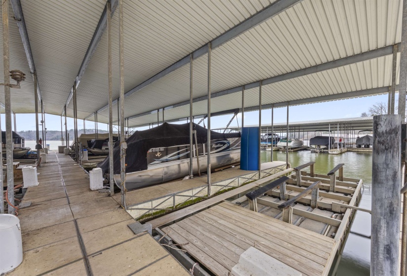 Dock featuring a water view and boat lift