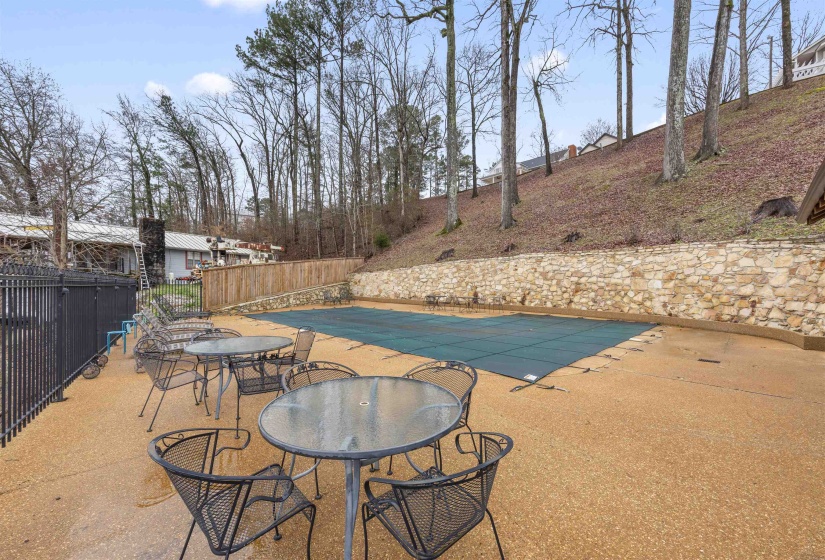 View of swimming pool featuring a patio area and outdoor dining area