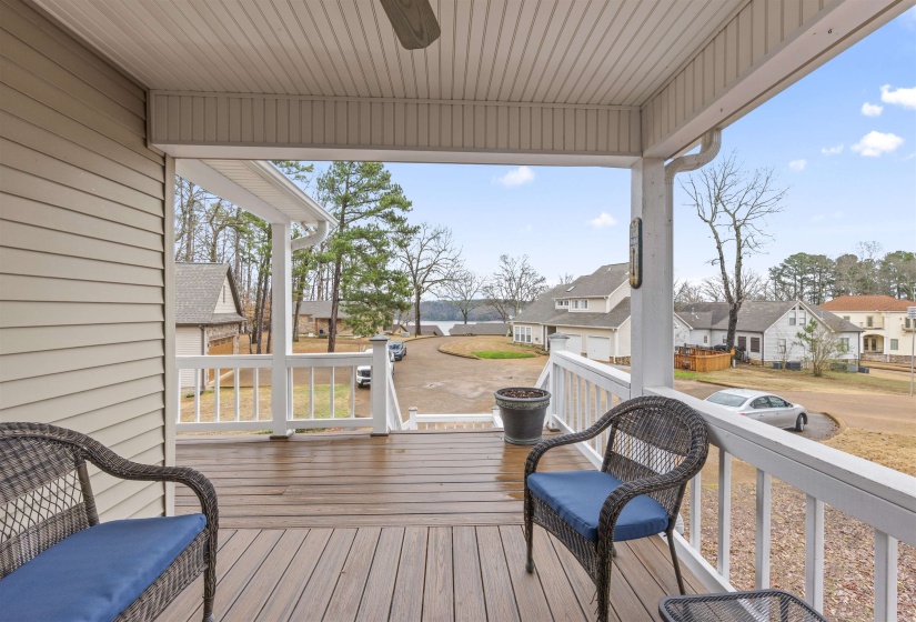 Deck with a residential view and ceiling fan