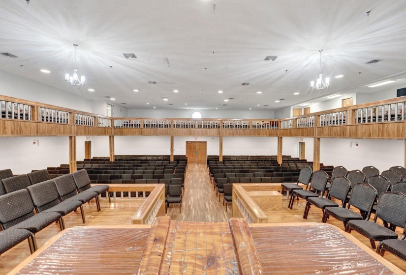 Interior space featuring an inviting chandelier and hardwood / wood-style flooring