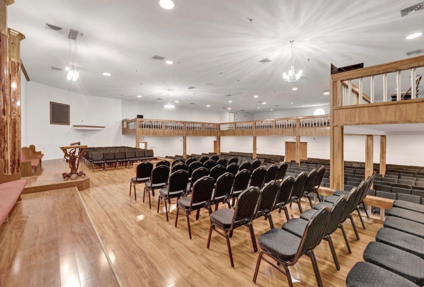Interior space with a chandelier and light hardwood / wood-style floors
