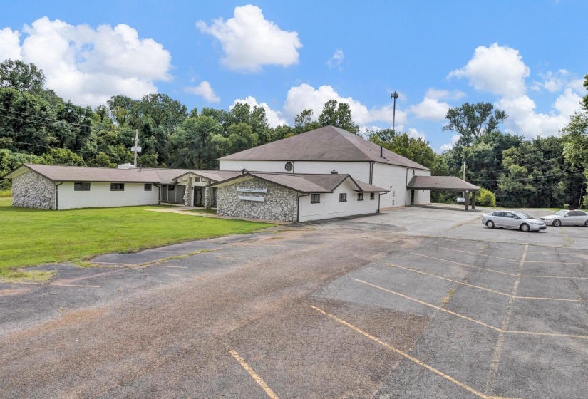 Exterior space with a carport and a front yard