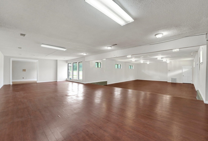 Spare room with dark hardwood / wood-style flooring and a textured ceiling