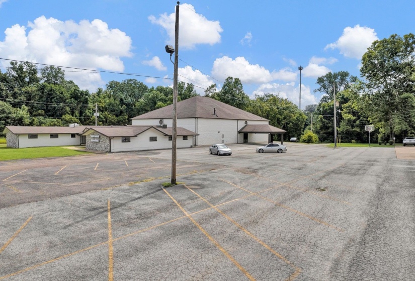 View of parking with a garage