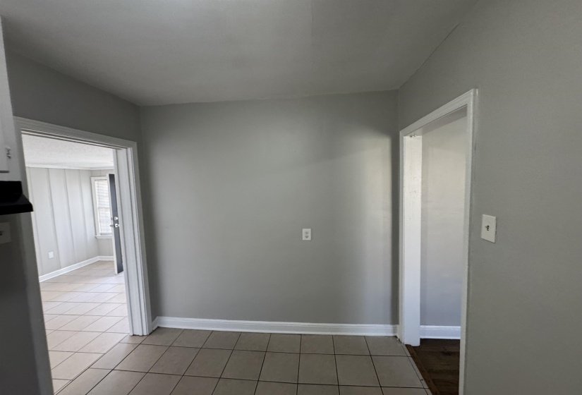 Empty room featuring light tile patterned floors