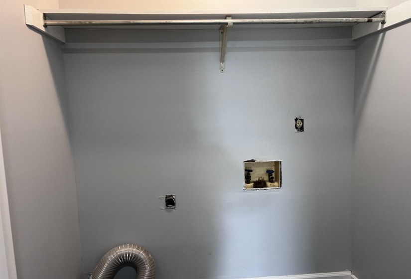 Laundry area with hookup for a washing machine and electric dryer hookup