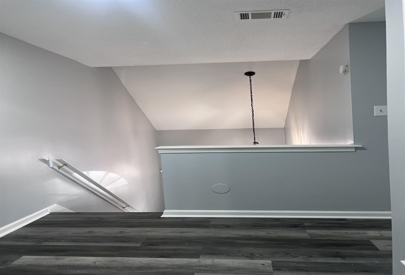Stairs featuring baseboards and wood finished floors