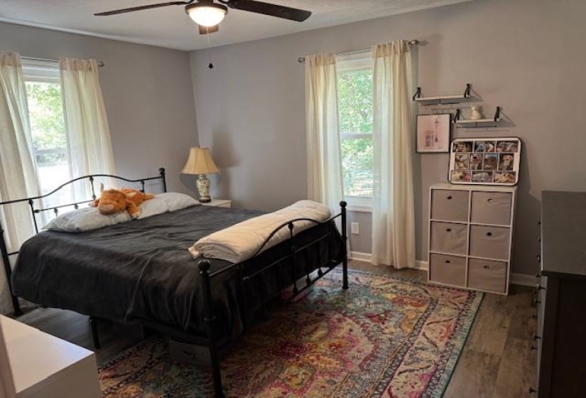 Bedroom featuring wood finished floors and ceiling fan