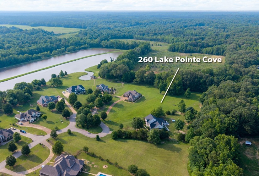 Aerial view of property's location featuring a large body of water and property parcel outlined