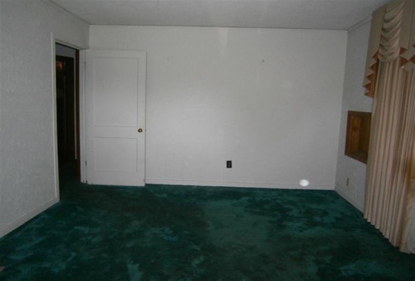 Unfurnished room with carpet and baseboards
