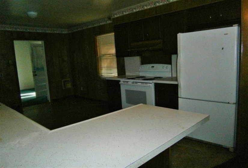 Kitchen with white appliances and light countertops
