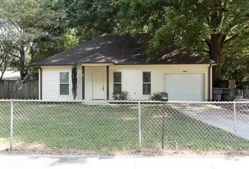 View of front of home with an attached garage and driveway