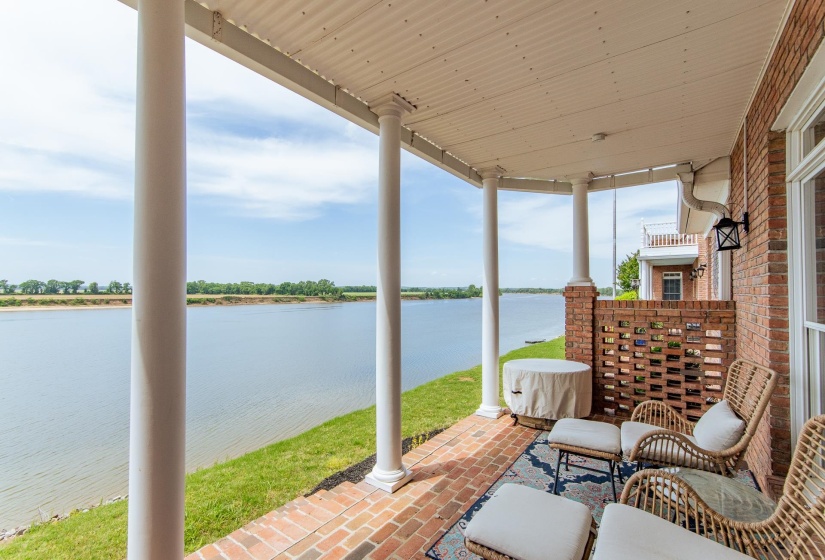 View of patio / terrace with a water view