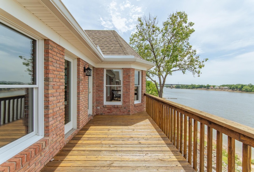 Wooden deck featuring a water view