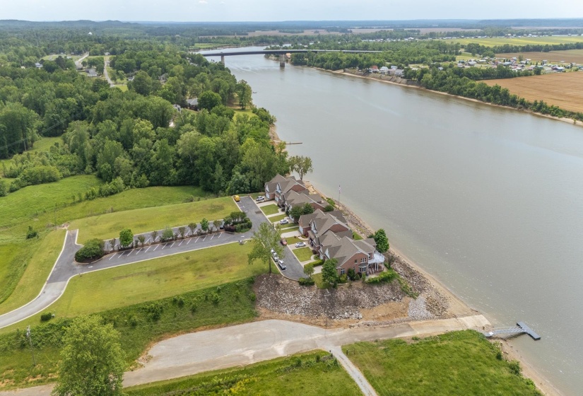 Birds eye view of property with a water view