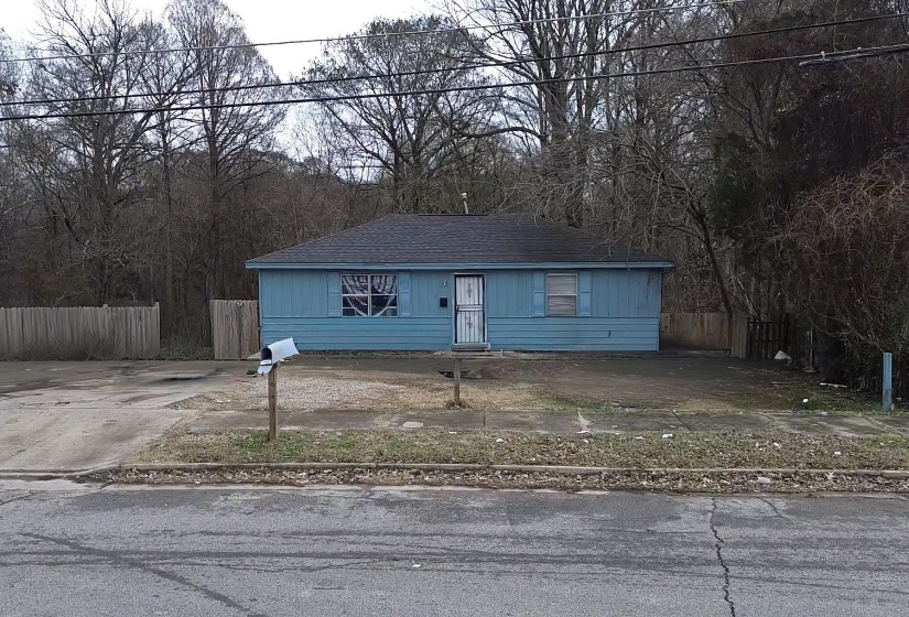 View of front of house featuring roof with shingles