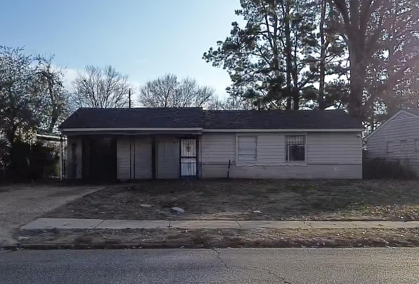 Garage featuring driveway
