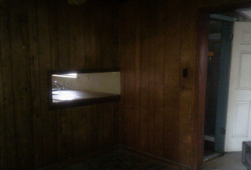 Miscellaneous room featuring wood walls