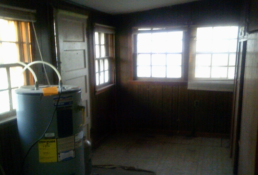 Utility room featuring electric water heater