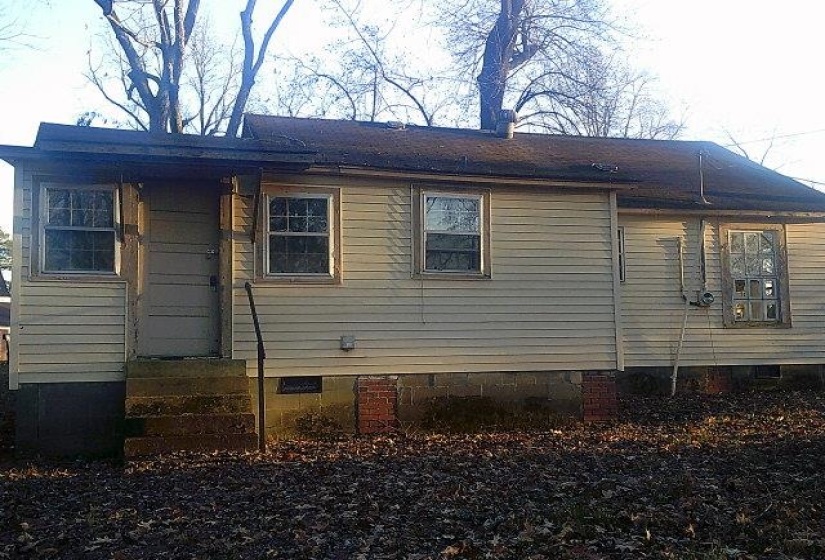 Rear view of house with crawl space