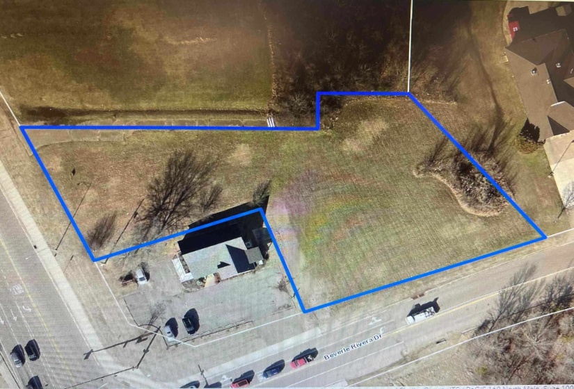 Aerial map of property and surrounding area with property parcel outlined