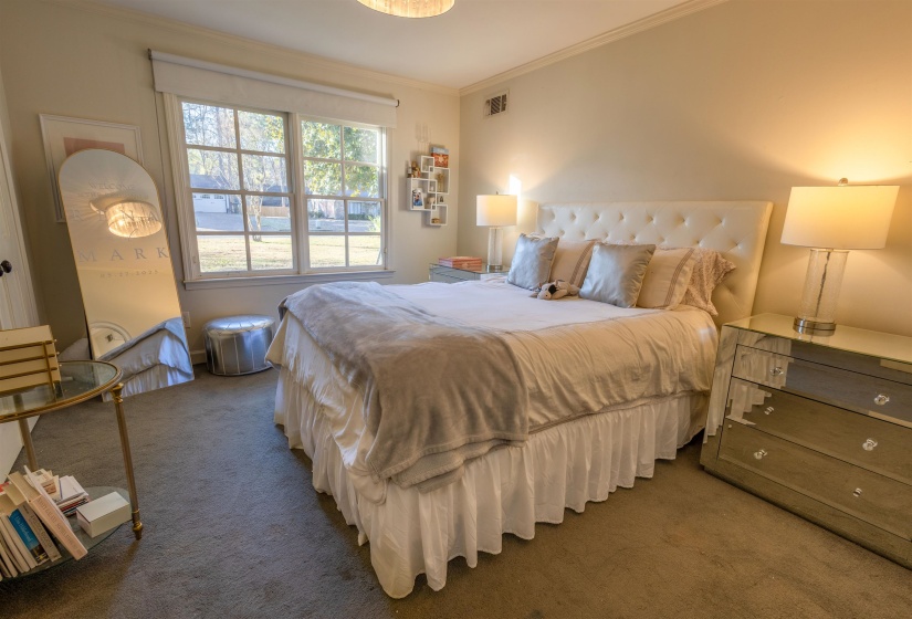 Bedroom with carpet and ornamental molding