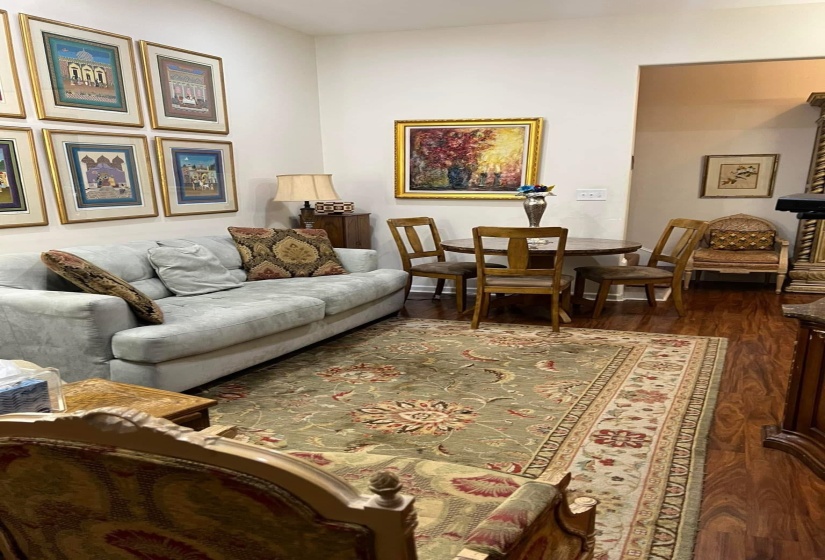 Living area with dark wood-style flooring