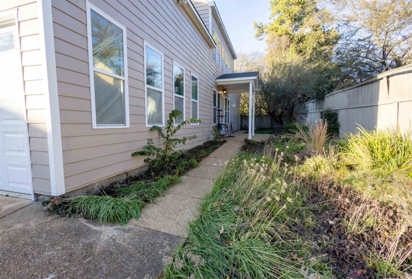 Property entrance with a patio