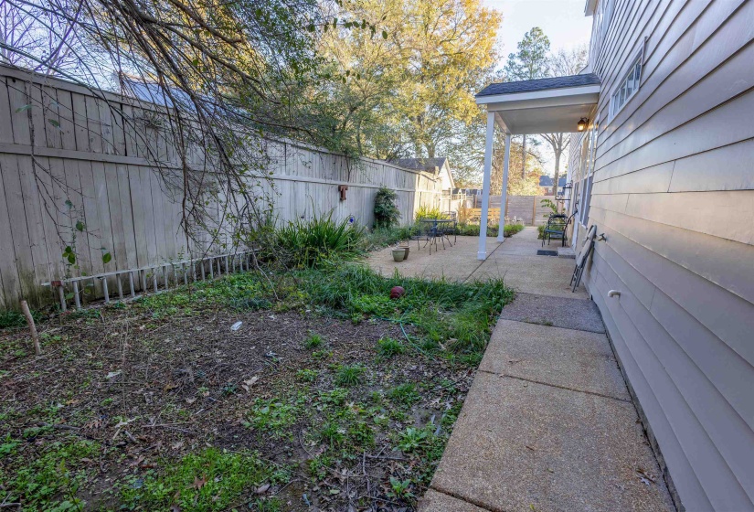 Fenced backyard with a patio area