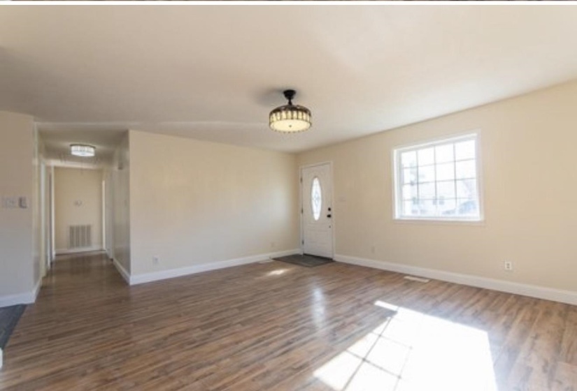 Entrance foyer with wood finished floors