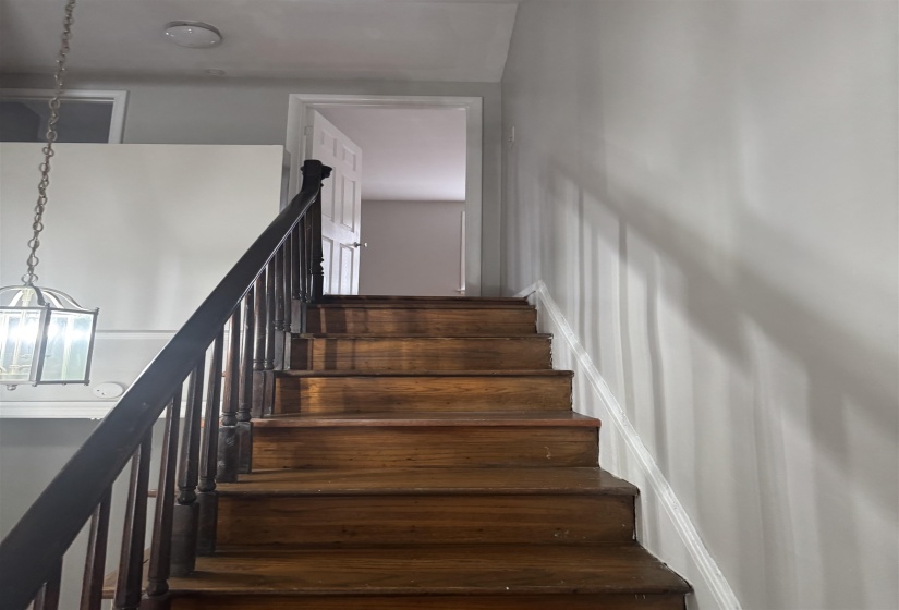 Stairs with a chandelier