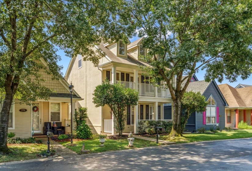 Cape cod house with covered porch and a front yard