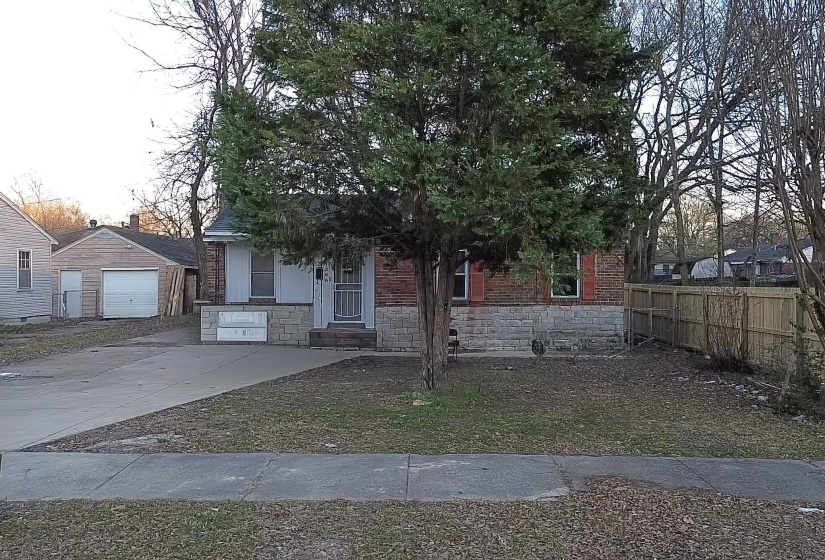 View of front of house with stone siding and brick siding