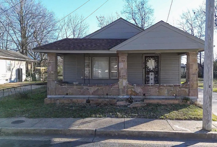 Bungalow-style house featuring covered porch and a shingled roof