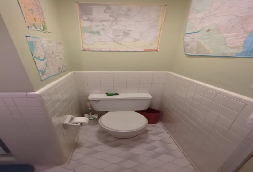 Bathroom featuring wainscoting and tile walls
