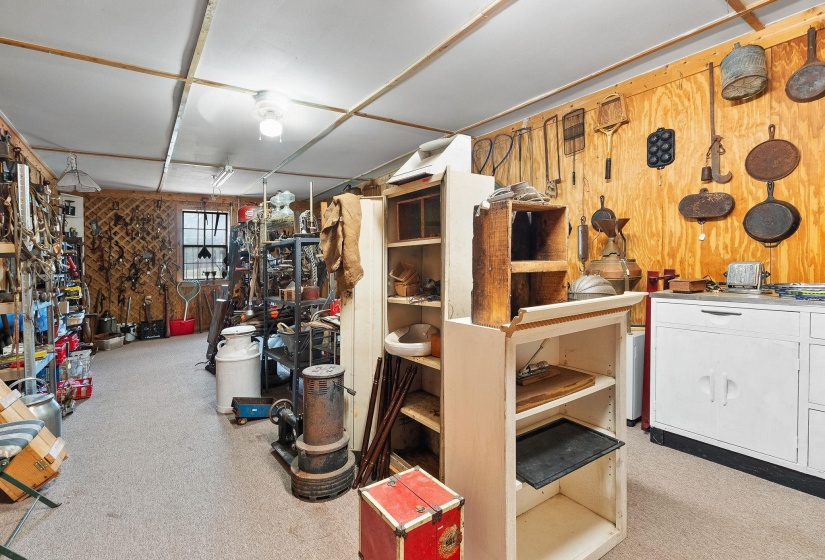 Below grade area with wood walls and a workshop area