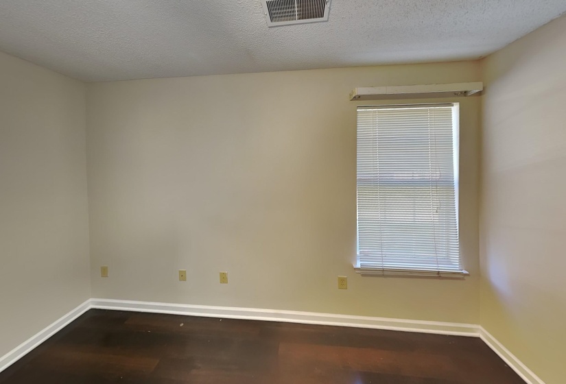 Empty room with a textured ceiling