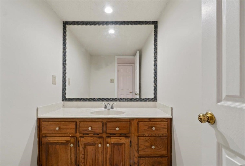 Bathroom featuring vanity and recessed lighting