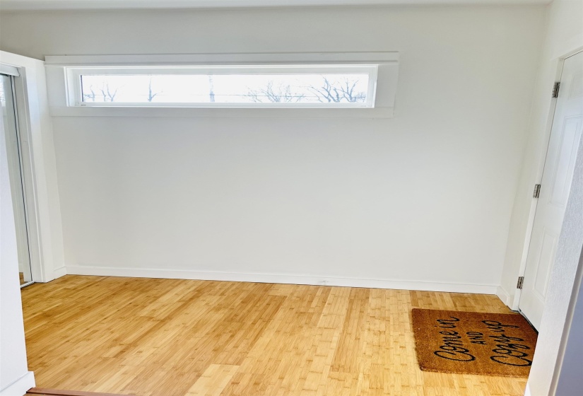 Unfurnished room featuring light wood-style floors and baseboards