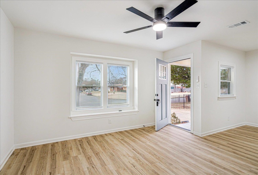 Foyer entrance featuring light wood-style flooring and ceiling fan