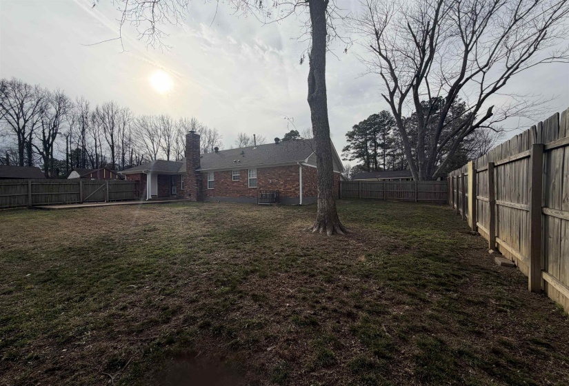 Fenced backyard with a patio area
