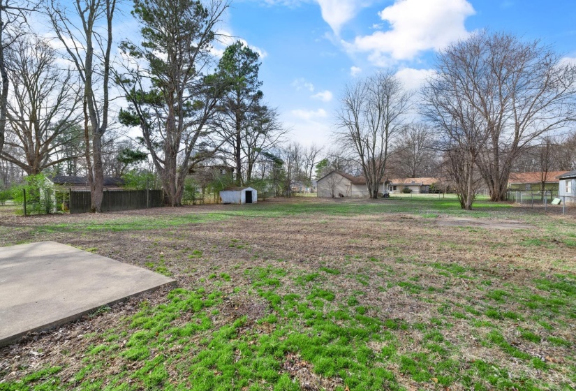 View of yard featuring a storage unit